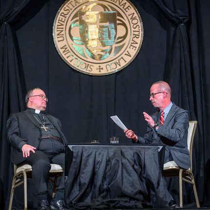 Archbishop Scicluna and moderator John Allen engage in a discussion on the sexual abuse crisis in the Catholic Church (Photo by Matt Cashore/University of Notre Dame)